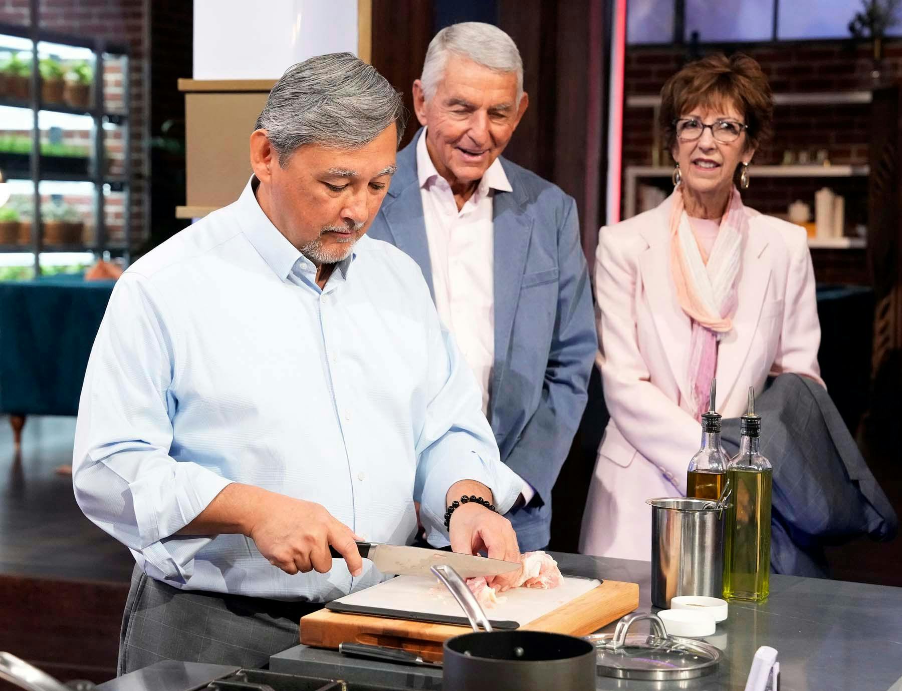 Chris Walinksi, DDS, prepares a dish as his birth father and his wife watch on the set of MasterChef. | © 2024 FOXMEDIA LLC. Cr: FOX.