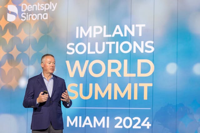 Denstply Sirona President and Chief Executive Officer Simon Campion speaks at the Implant Solutions World Summit in Miami. | Image Credit: © Dentsply Sirona